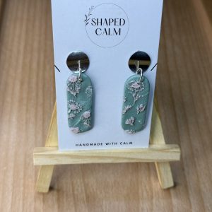 Soft pink daisy’s on light green earrings