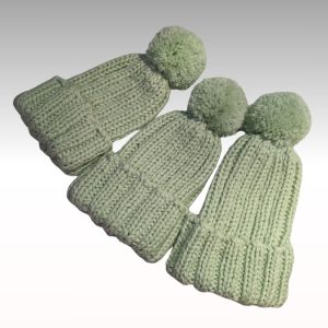 Handknitted hat with pom pom for children