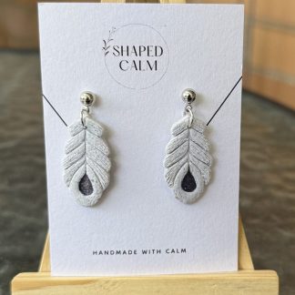 Feather detail dangle earrings