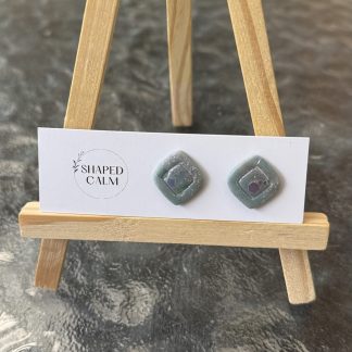 Light teal shimmery stud earrings